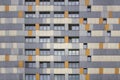 Bright multi-colored facade of a high-rise modern building with windows