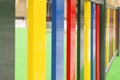 Bright multi-colored fence of a playground for children close-up Royalty Free Stock Photo