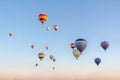 Bright multi-colored hot air balloons flying in sunsrise sky Royalty Free Stock Photo
