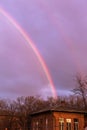 Bright multi-colored rainbow in the rays of the evening sunset sun against the sky in clouds after rain. Rainbow, Good News, Royalty Free Stock Photo