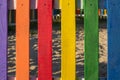 Bright and multi colorful wooden fence on children& x27;s playground Royalty Free Stock Photo