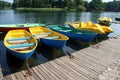 Bright multicolored boats and catamarans at the pier on a sunny summer day. The picture was taken at the GalvÃâ lake in Lithuania Royalty Free Stock Photo