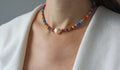 Bright multicolored Venetian glass, pearl of Kasumi necklace. A short necklace on a girl made of natural Kasumi pearl stones.