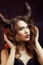 Bright mysterious woman with horn hair, halloween celebration Royalty Free Stock Photo