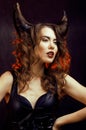 Bright mysterious woman with horn hair, halloween celebration Royalty Free Stock Photo