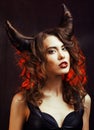 Bright mysterious woman with horn hair, halloween celebration Royalty Free Stock Photo