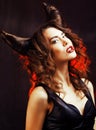 Bright mysterious woman with horn hair, halloween celebration Royalty Free Stock Photo