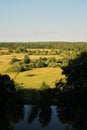 A bright natural landscape in the fall season. A view over the forest and meadows of Ukraine