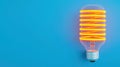 Bright Neon Light Bulb Design on Blue Background for Creative and Modern Concepts Royalty Free Stock Photo