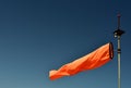 Bright neon orange wind sock blowing indicating wind Royalty Free Stock Photo