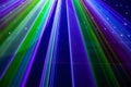 Bright nightclub red, green, purple, white, pink, blue laser lights cutting through smoke machine smoke making light patterns Royalty Free Stock Photo