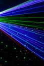 Bright nightclub red, green, purple, white, pink, blue laser lights cutting through smoke machine smoke making light patterns Royalty Free Stock Photo