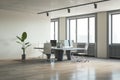 Bright office interior with wooden flooring, furniture and daylight, window and city view. Royalty Free Stock Photo