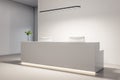 Bright office lobby with white reception desk
