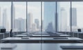 Bright Office Space with Empty Desks and Cityscape View through Large Windows, Clean Interior Design in White and Gray, Workplace Royalty Free Stock Photo