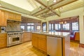 Bright, open kitchen with vaulted ceilings and wooden beams