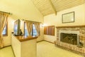 Bright, open and master bedroom additional room with vaulted ceilings and fireplace