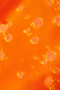 Bright Orange Abstract Background with Floating Oil Bubbles. abstract macro cool Royalty Free Stock Photo