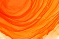 Bright orange alcohol ink wallpaper. Hand drawn abstract watercolor background. Paintbrush orange strokes.