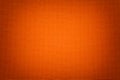 Bright orange background from a textile material with wicker pattern, closeup Royalty Free Stock Photo