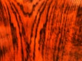 The bright orange and black plank. Background with board.