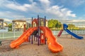 Bright orange and blue slides at a colorful fun playground for children