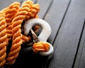 Orange nylon braided rope with metal tow hook. Royalty Free Stock Photo