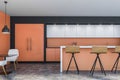 Bright orange cafe interior with bar counter