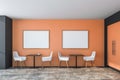 Bright orange cafe interior with posters