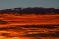 Bright orange clouds at sunset, like lava. Royalty Free Stock Photo