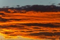 Bright orange clouds at sunset, like lava. Royalty Free Stock Photo