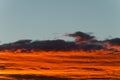 Bright orange clouds at sunset, like lava. Royalty Free Stock Photo