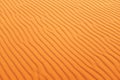 Bright orange desert sand ripples for warm background and summer background Royalty Free Stock Photo