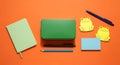 Bright Orange Desktop Mockup with Stationery and Playful Frog Notes for Creative Projects Royalty Free Stock Photo