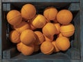 Bright orange effervescent balls for the bathroom in a wooden box on the market, top view