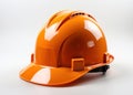 A bright orange hardhat resting on a pristine white surface, construction site photo