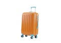 Bright orange hardshell rolling suitcase on black background Royalty Free Stock Photo