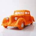 Bright Orange Knitted Car: A Unique Still Life Masterpiece