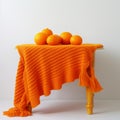 Bright Orange Knitted Table: A Playful Still Life Photo