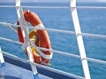 Bright orange lifebuoy on the ferry deck Royalty Free Stock Photo