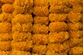 Bright, orange marigold, floral garlands for celebration and religious offerings