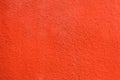 Bright orange painted stucco wall. Background texture Royalty Free Stock Photo