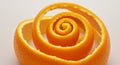 Bright Orange Peel Spiral on White Background Royalty Free Stock Photo