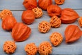Bright orange physalis and wicker balls on a blue wooden background