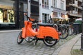 Bright orange scooter on the street of Dresden, Germany