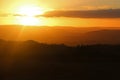 Bright orange sky sunset from Stapeley Hill, Shropshire looking over the Welsh Hills Royalty Free Stock Photo