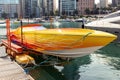 Bright orange speedboat at pier in the port of Beirut. Republic of Lebanon