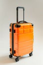 A bright orange suitcase with wheels sits on a white background. Generative AI Royalty Free Stock Photo