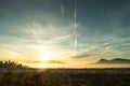 Bright orange sunset over distant mountains Royalty Free Stock Photo