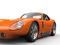 Bright orange vintage sports car - headlight extreme closeup shot Royalty Free Stock Photo